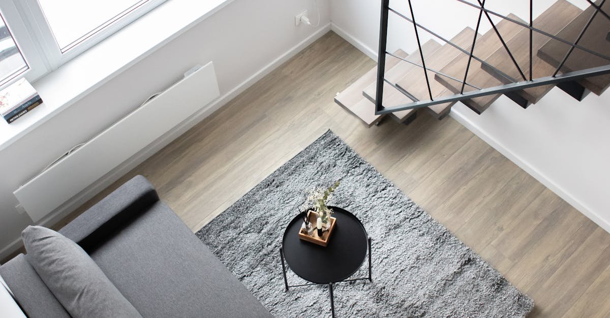 Aerial view of a stylish minimalist loft with modern furnishings and elegant decor.